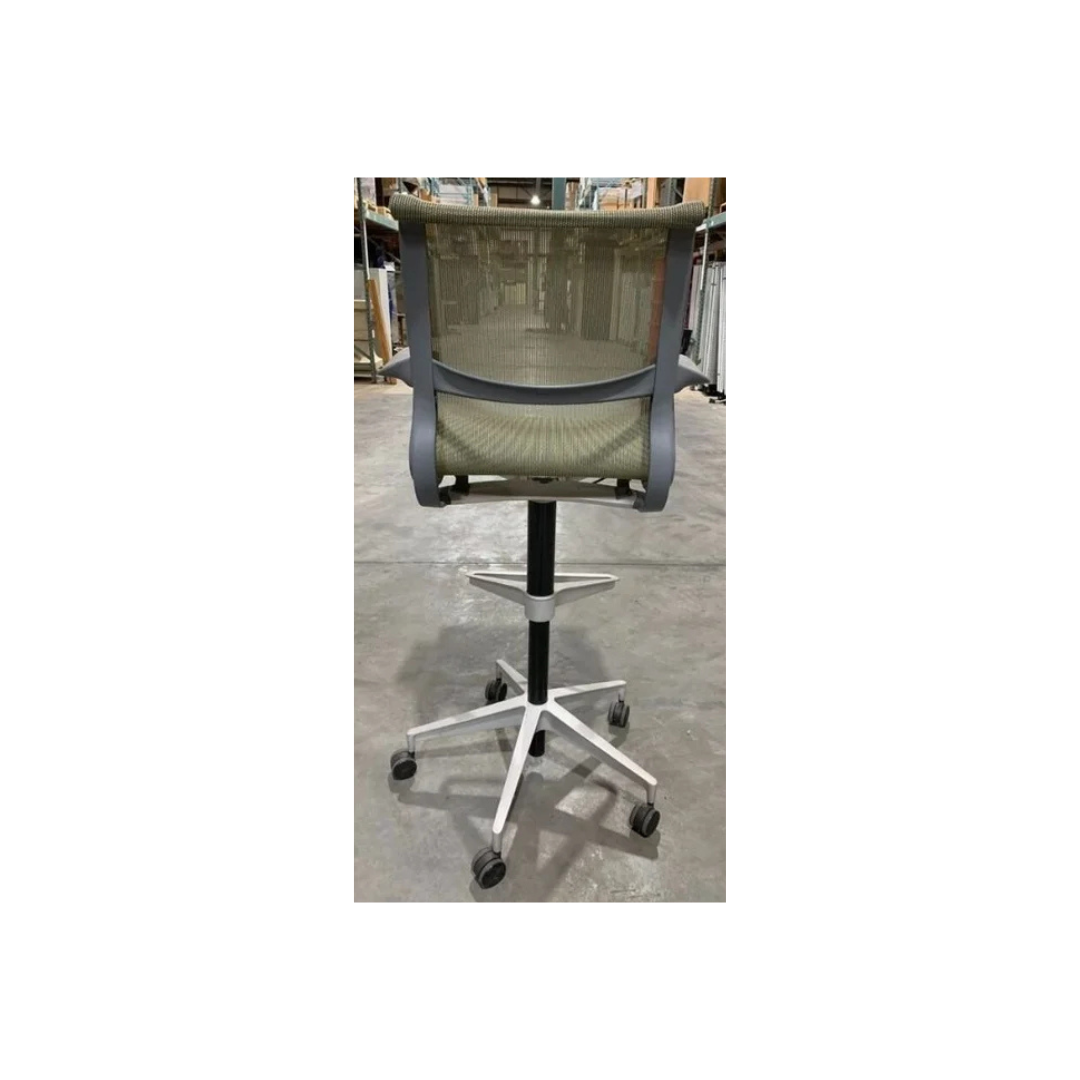 Modern Herman Miller Setu stool in two-tone green mesh with fixed arms and five-prong rolling base