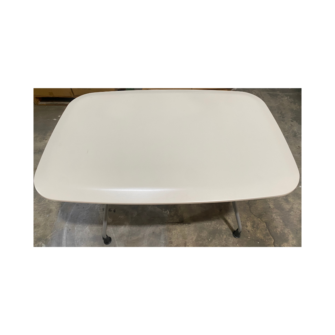 Herman Miller Avive table with a rounded-square white top and silver angled legs