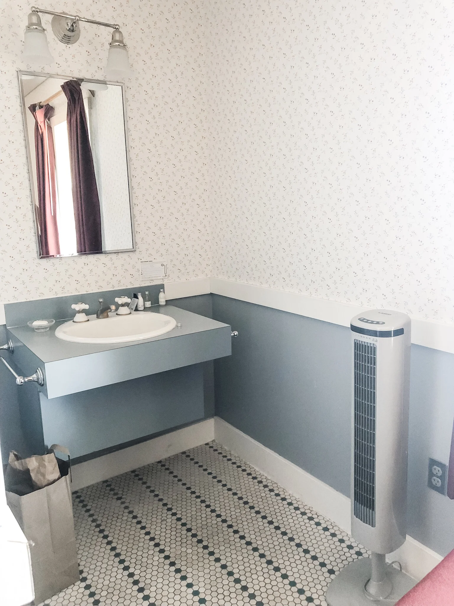 The sink and tile were part of the bedroom. Rubber or house slippers are not a bad idea.