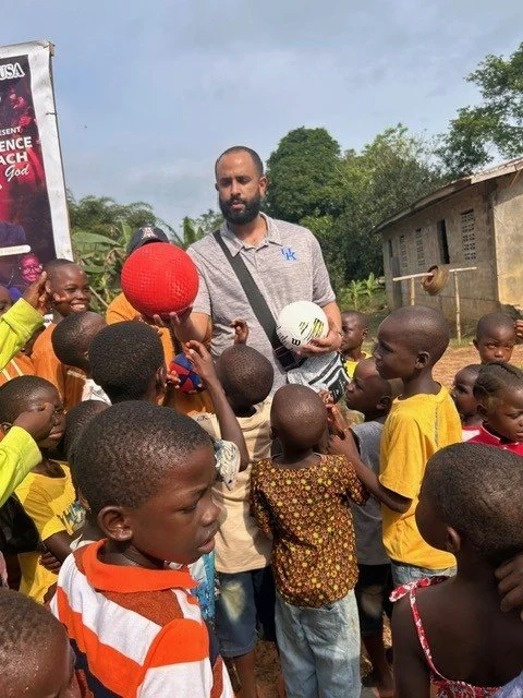 Kevin giving out balls.jpg