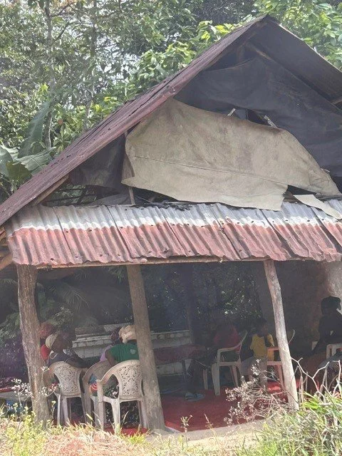 Meeting in a hut.jpg