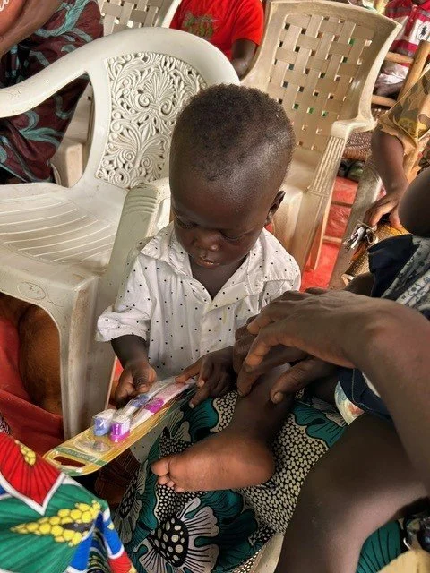 toddler getting tooth brushes.jpg
