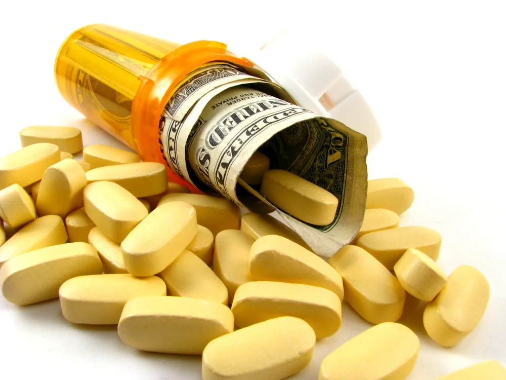 Prescription-bottle-and-dollars.jpg