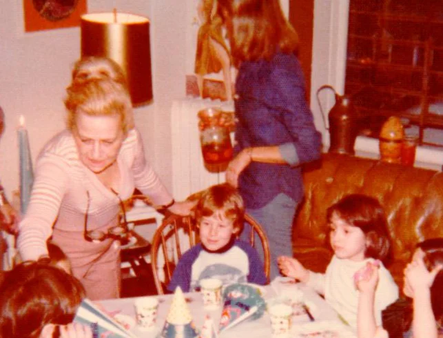 Aunt Molly and I on what looks like my fifth birthday. P.S. — lower right with the hand over her face is the actress, Jennifer Connelly.