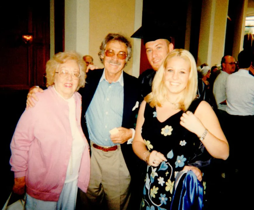 Grandma Charlotte, my dad (her son), me and my sister at my law school graduation — 1997.