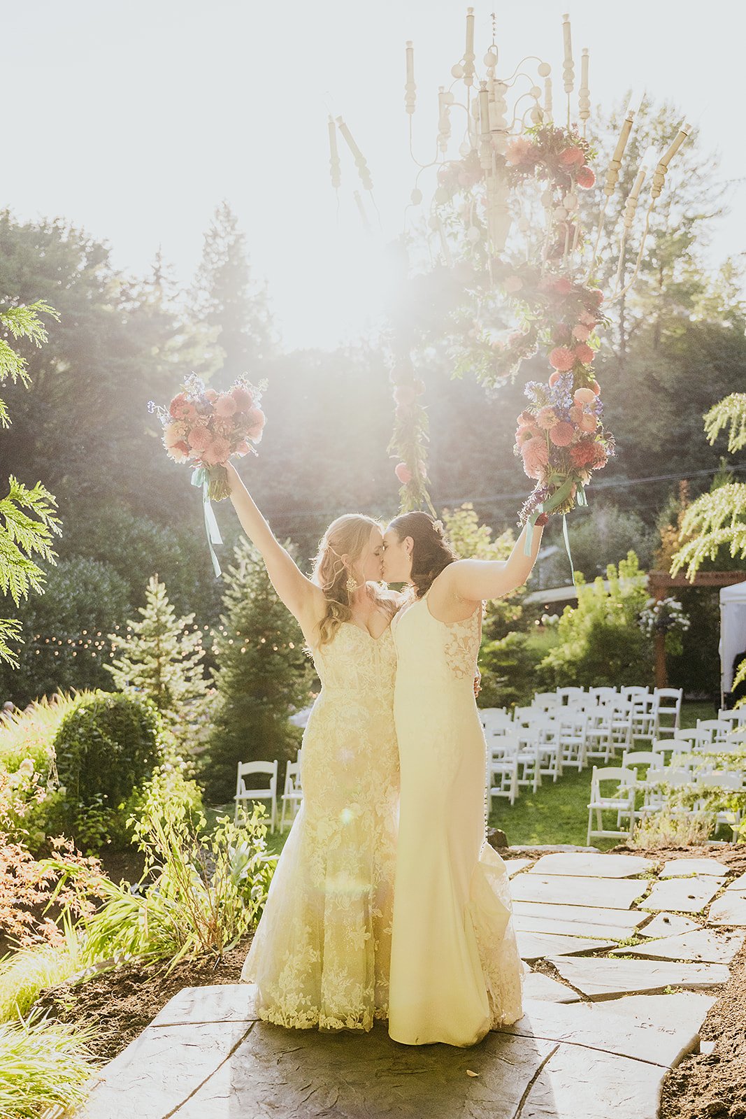 Couple kissing with bouquets in their hands