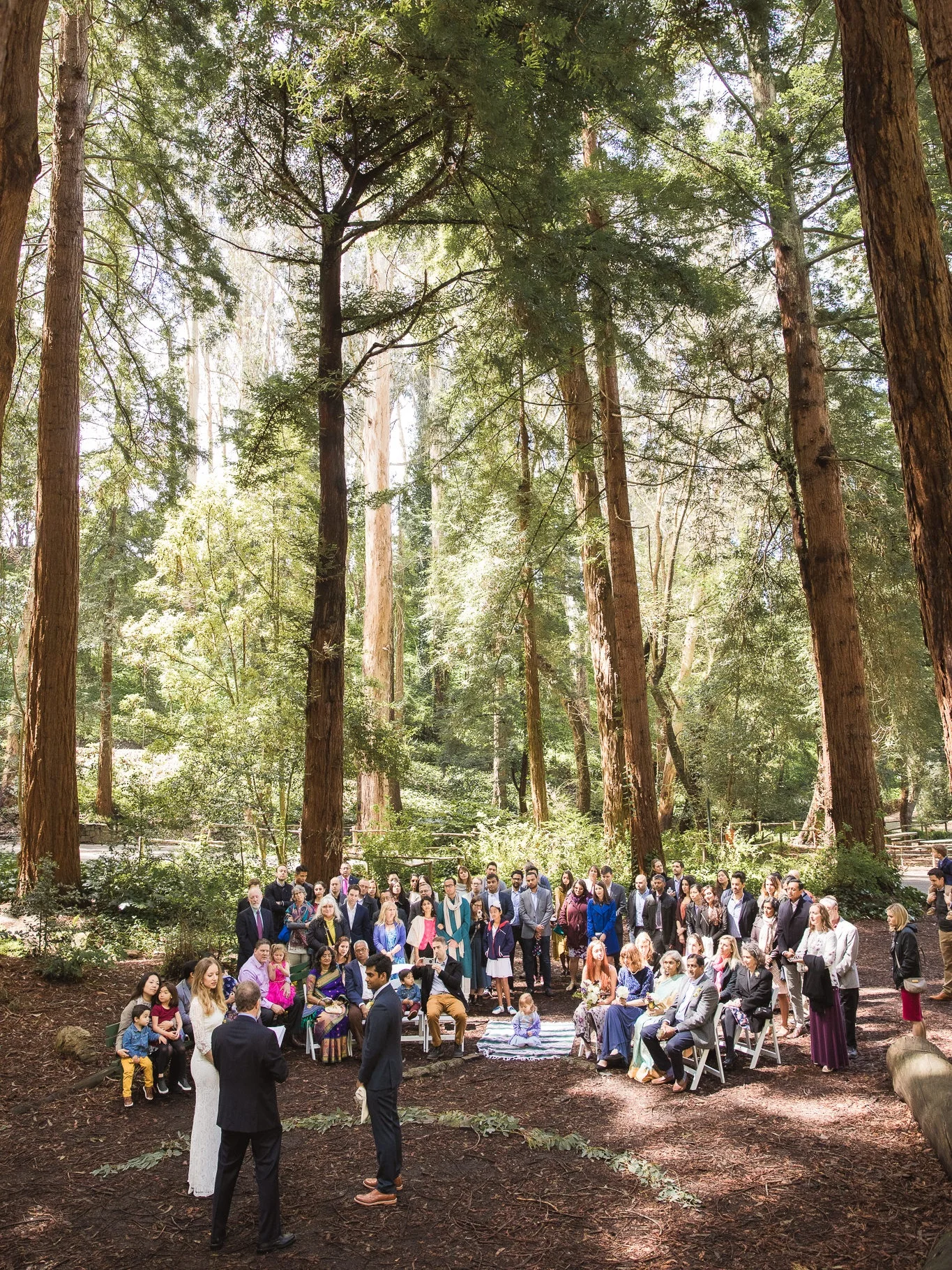 The ceremony setup allowed for some seats and some standing room. This unique setup creates a nice dynamic for photographs. Also…check out those tall trees! So lovely <3.