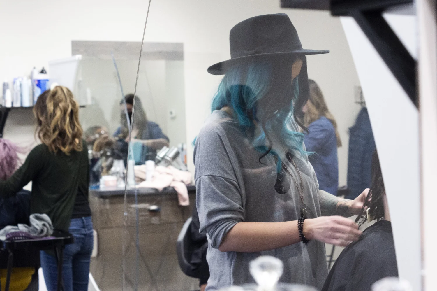Theory Hair Studio stylist working with a guest