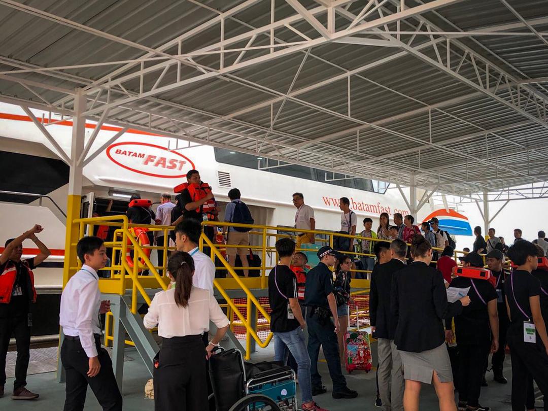 STEP FOUR: BOARDING THE TENDER FERRY Guests after disembarking will board the ferry through the sheltered pontoon, up the ramp and onboard the ferry. It will take approximately 20 minutes for the transfer to Singapore Cruise Centre @ Harbourfront.