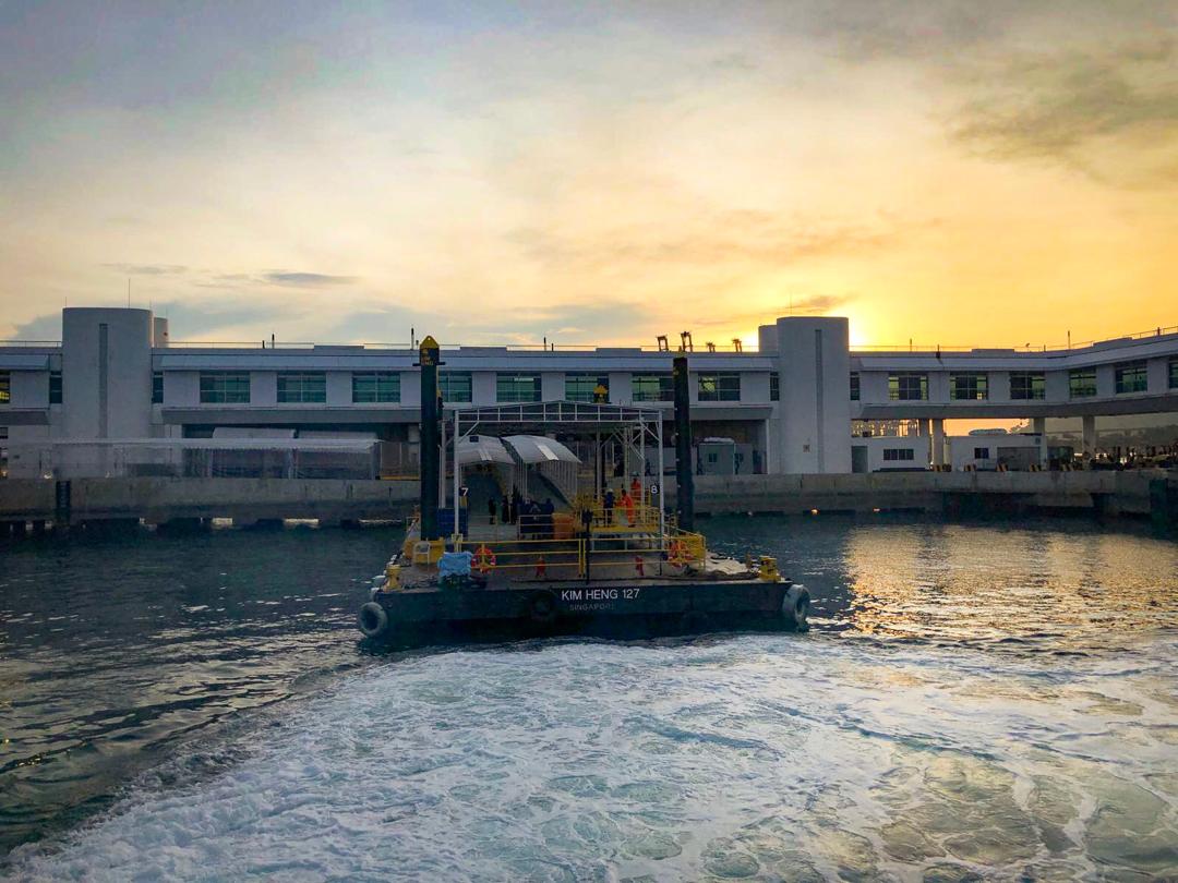 STEP FIVE: ARRIVAL AT SINGAPORE CRUISE CENTRE Guests then disembark the ferry through Pontoon Number 1, and enter the arrival hall through the sheltered walkway (shown on the left of the image). They will be processed and will collect their baggage denoted with their coloured disembarkation tickets. They will then proceed out of the terminal.