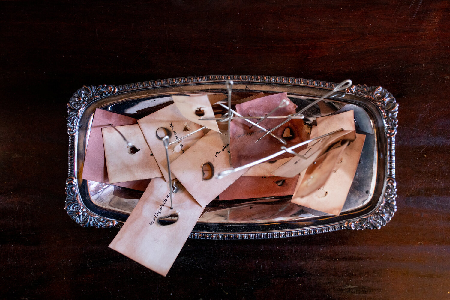   A reputation in tatters , calling cards, needles, silver tray 