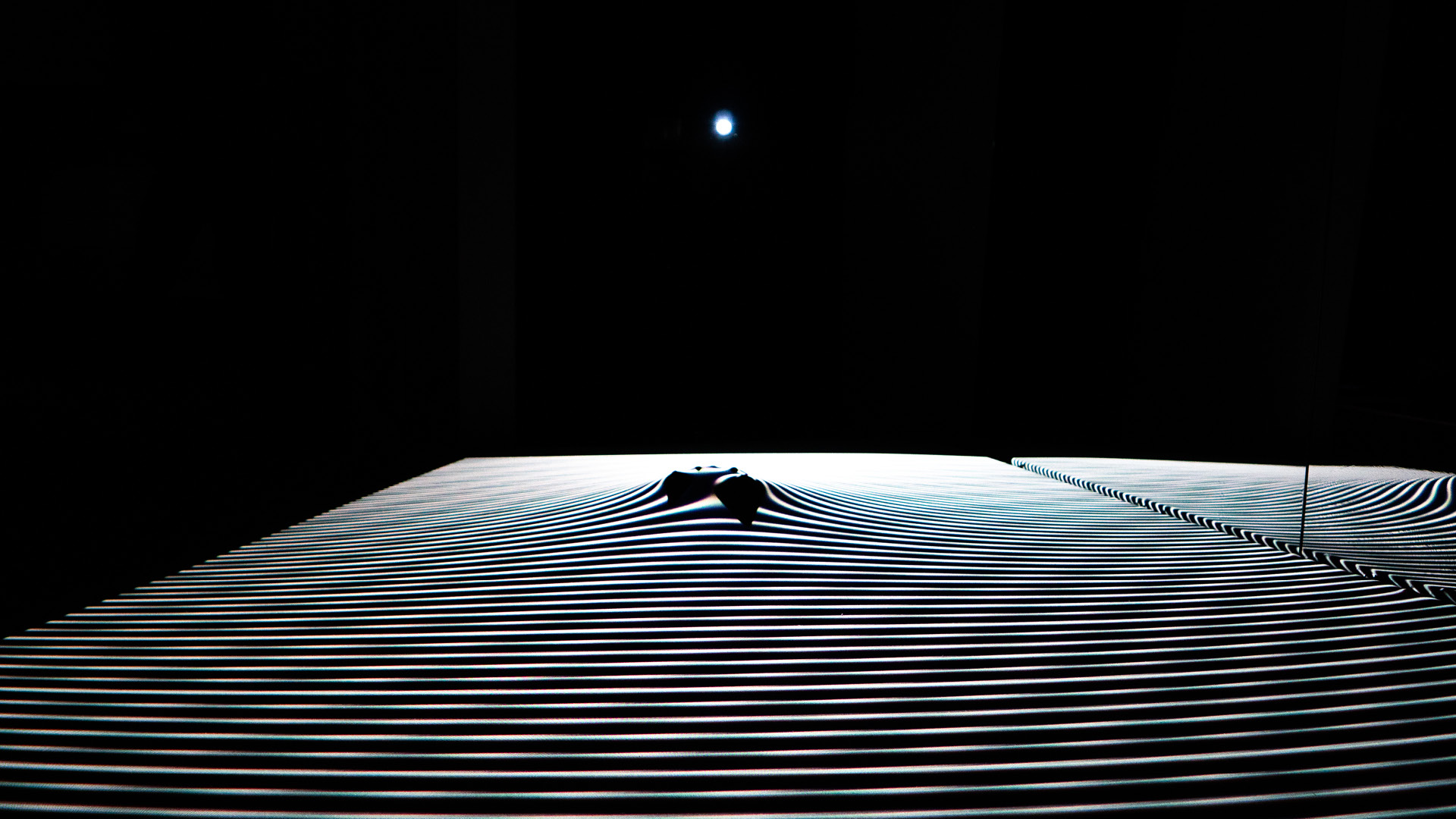    Contour    May 2019  Horizontal scrim with dancers beyond, in interaction with two projectors at different orientations; what results is a contoured artificial landscape.  Los Angeles Dance Project scenography residency  Creative Directors - Erin 