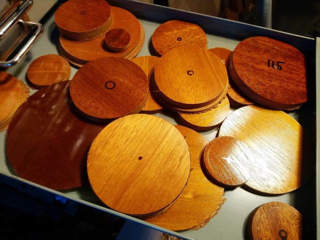 Behind the scenes - Lens board hole cutouts. These are just some of the cutouts from lens boards I have made (the rest ping about the workshop for me to find some weeks later!). They are handy as colour reference swatches for my French polish. Did yo