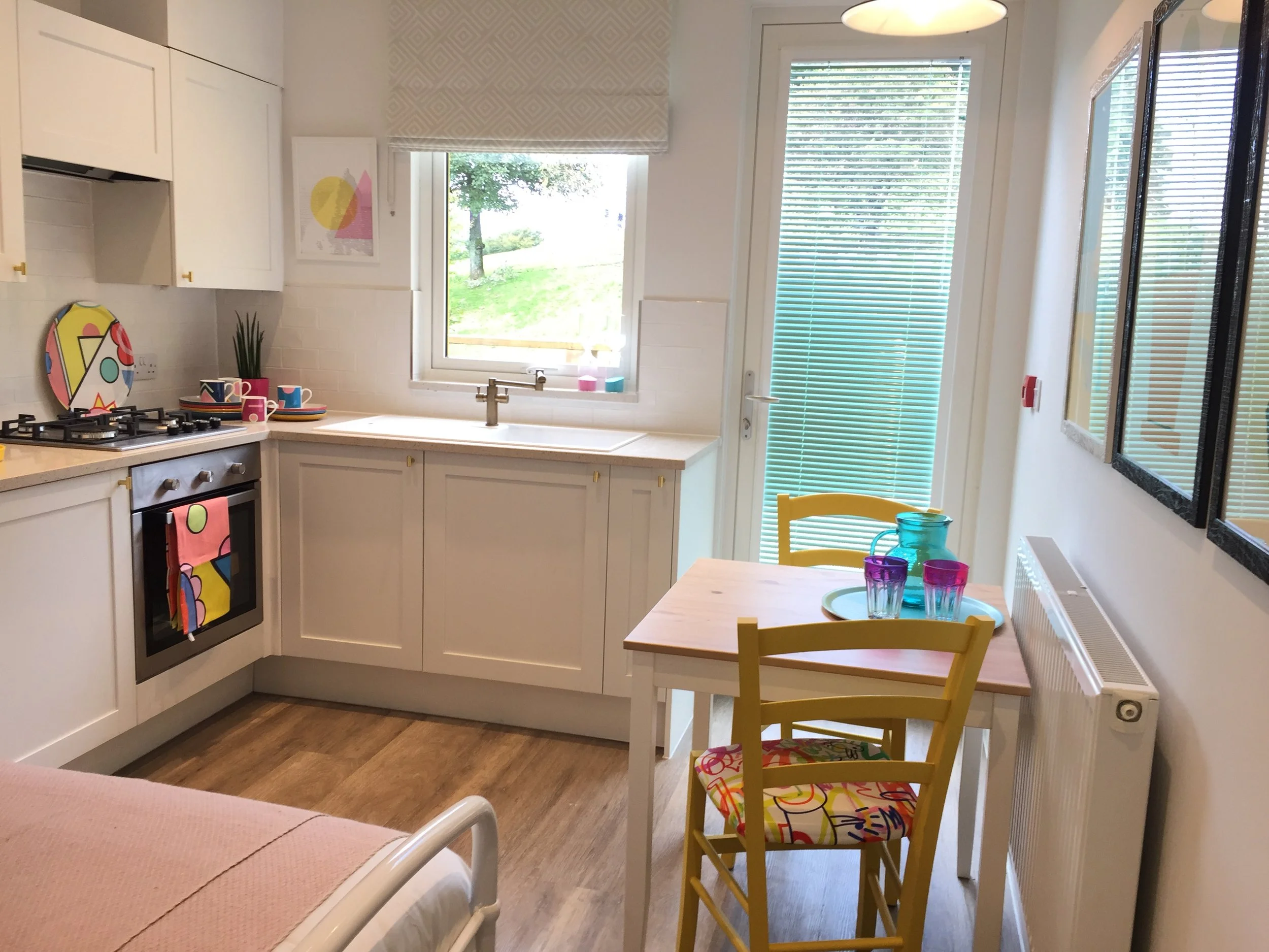 White shaker kitchen with dining area