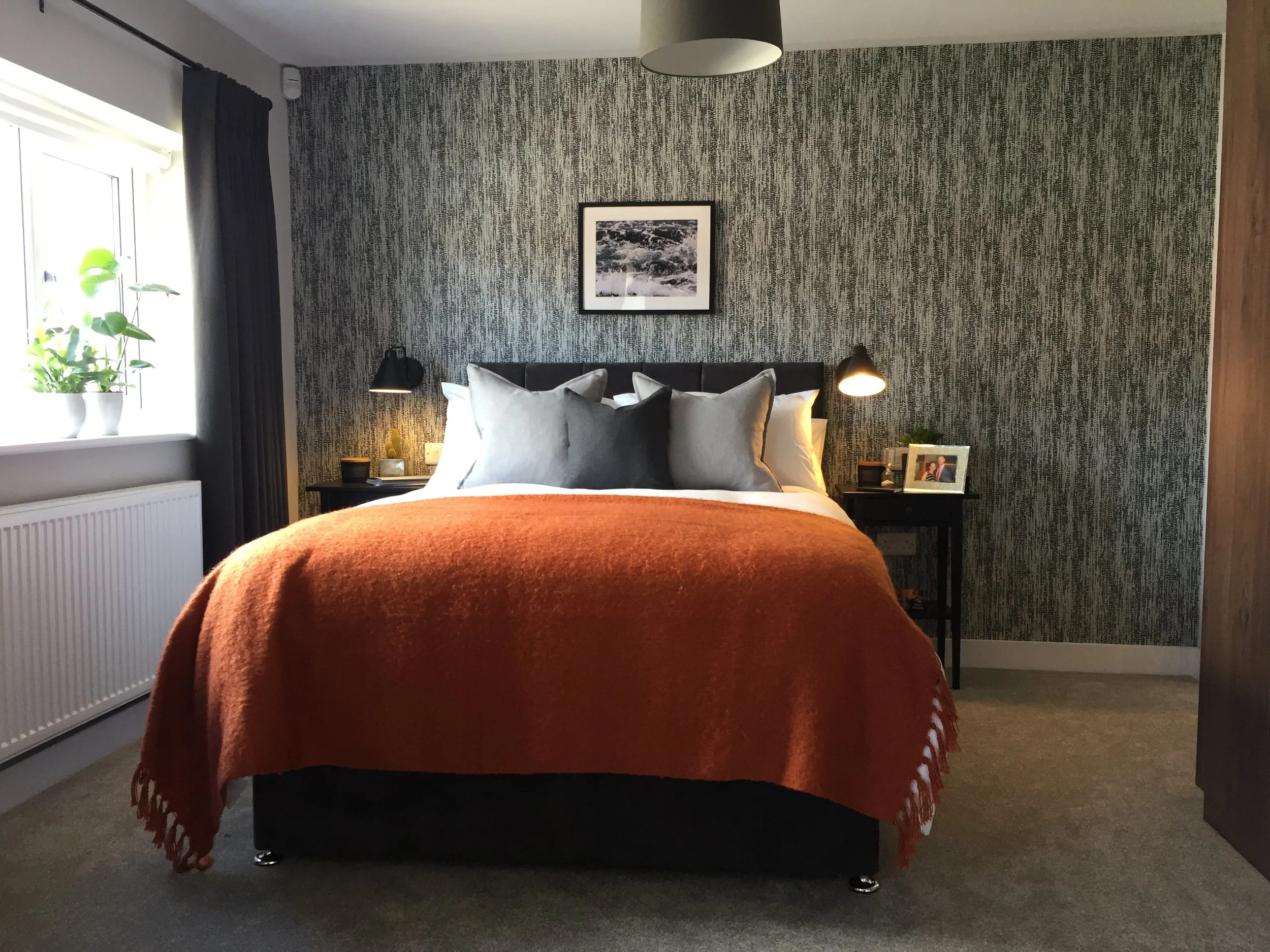 Monochrome bedroom with feature wallpaper