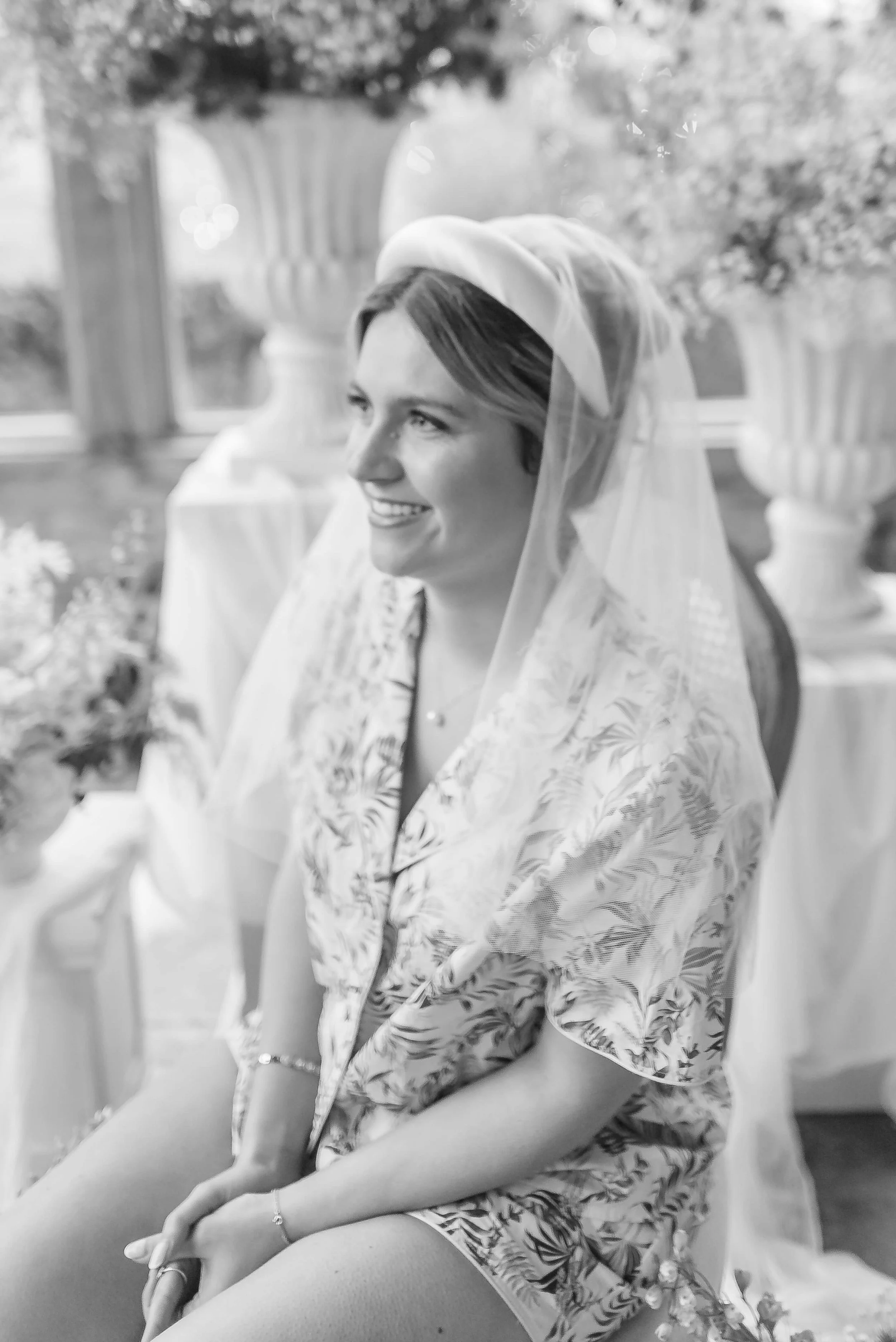 bride with veil surrounded by flowers wearing made your day bridal pjs