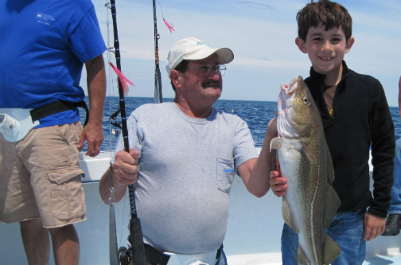 TATE (THE YOUNGEST) BROWN WITH HIS BIG CATCH AND PROUD GRAMPA (MICHIEL BROWN)