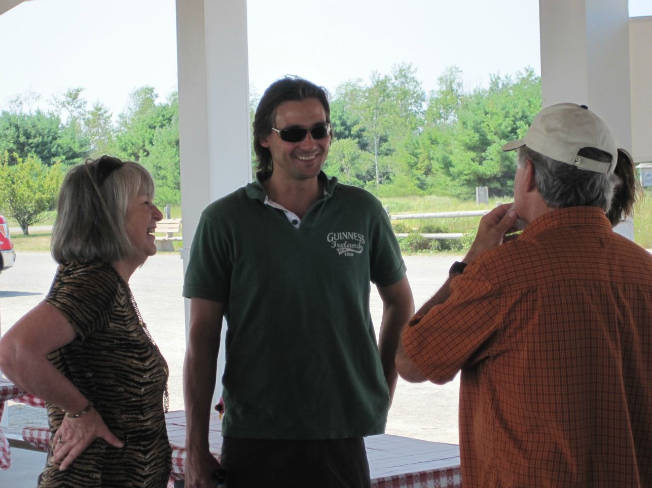 RETIRED OFFICE MANAGER, CHERYL SHEEHAN, CATCHES UP WITH ESTIMATOR, MIKE EDMONDS AT THE ANNUAL EMPLOYEE LOBSTER BAKE.