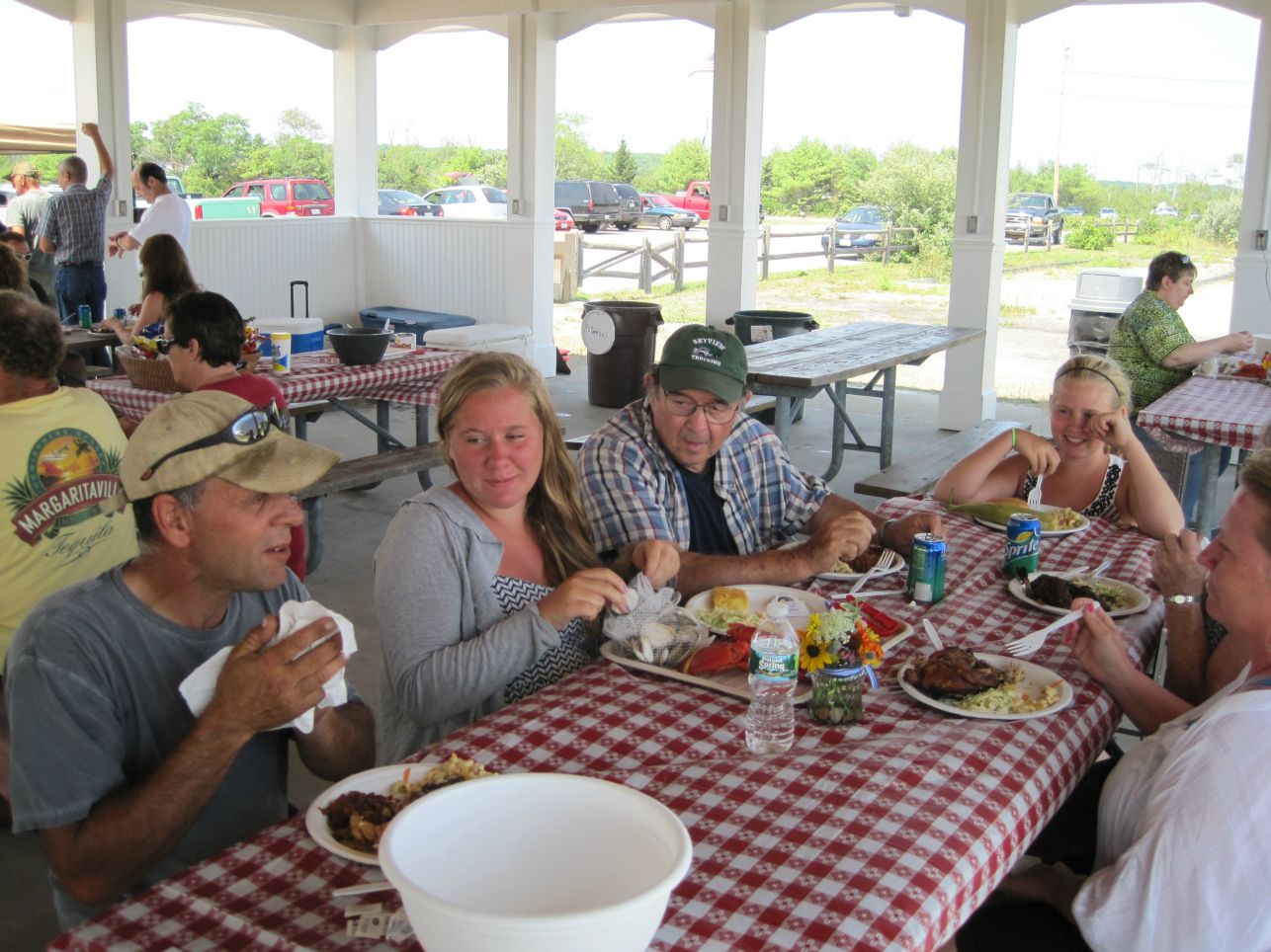 EMPLOYEE, CHUCK STEVENS, ENJOYS THE FOOD WITH HIS FAMILY AT THE ANNUAL EMPLOYEE LOBSTER BAKE.