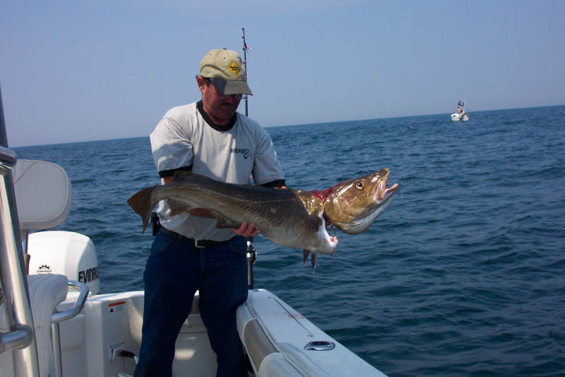 MIKE WITH HIS BIG CATCH ON THE BREX CORP. ANNUAL DEEP SEA FISHING TRIP