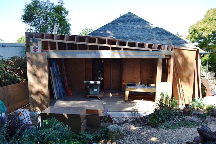 Enclosed structure. 15 foot opening will feature five hand-built sliding glass doors.