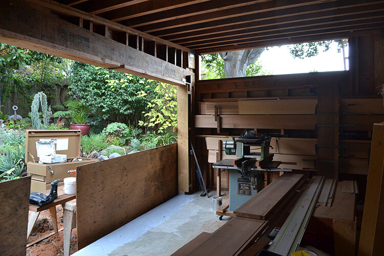With the garden abutting the cabin, the interior is both workspace and staging area.