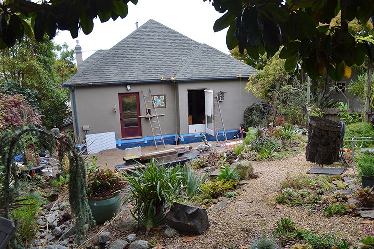 Client's house viewed from back garden. Cabin footprint will run 25 feet alongside back of house. 