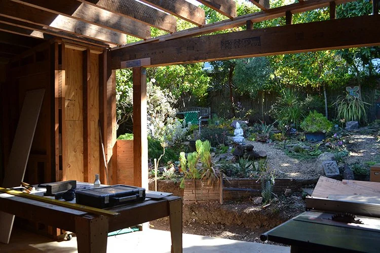 Looking out towards garden through future doorway. 2 x 10" framing materials salvaged from Pacific Heights mansion.