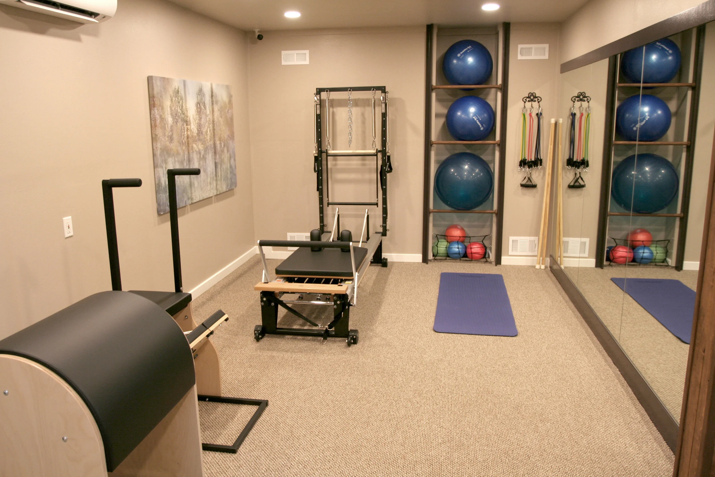 PICTURE OF PILATES STUDIO WITH VARIOUS EQUIPMENT.JPG