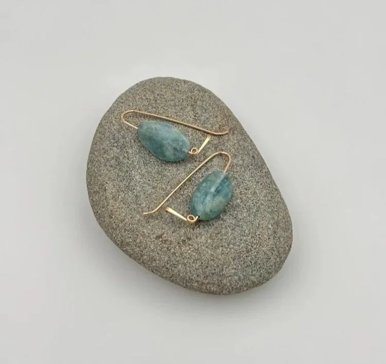 aquamarine+earrings+on+rock.jpg
