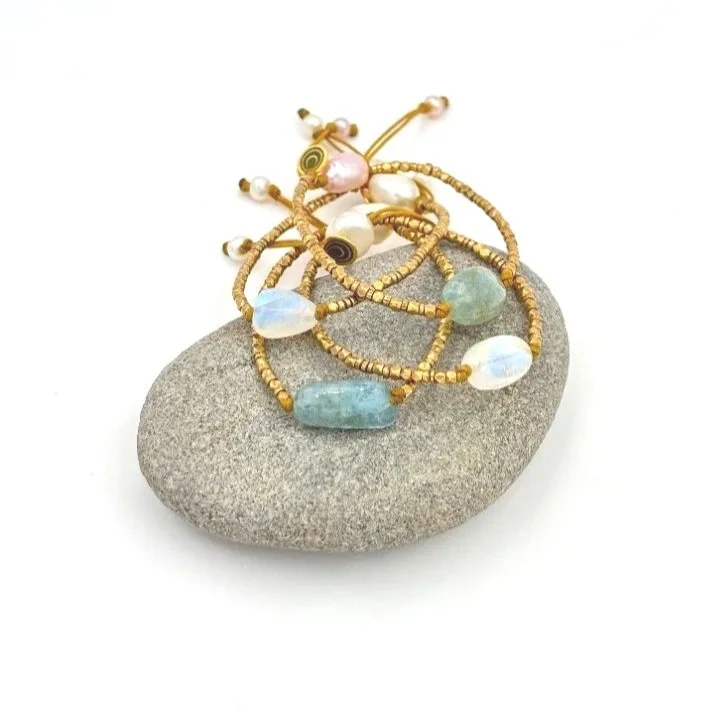 brass+and+moonstone+and+brass+and+aquamarine+bracelets+on+grey+rock+alt.jpg