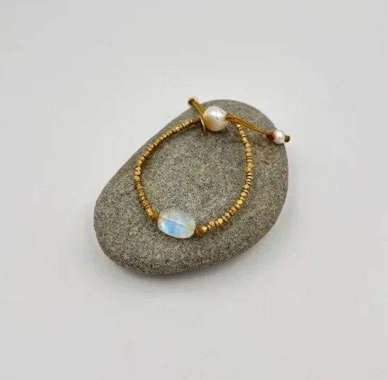 moonstone+and+brass+on+grey+rock.jpg