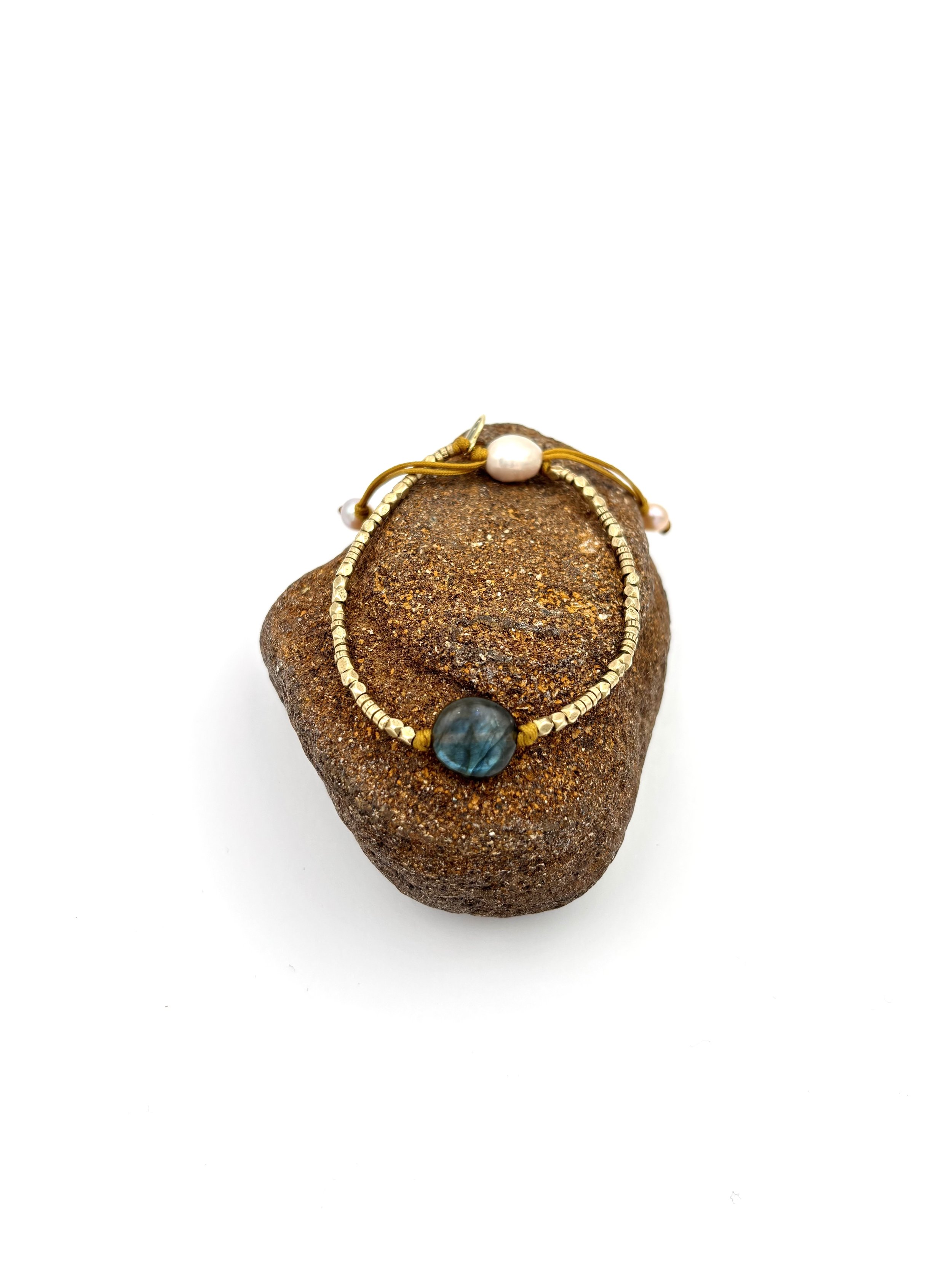 labradorite and brass on rock.jpg