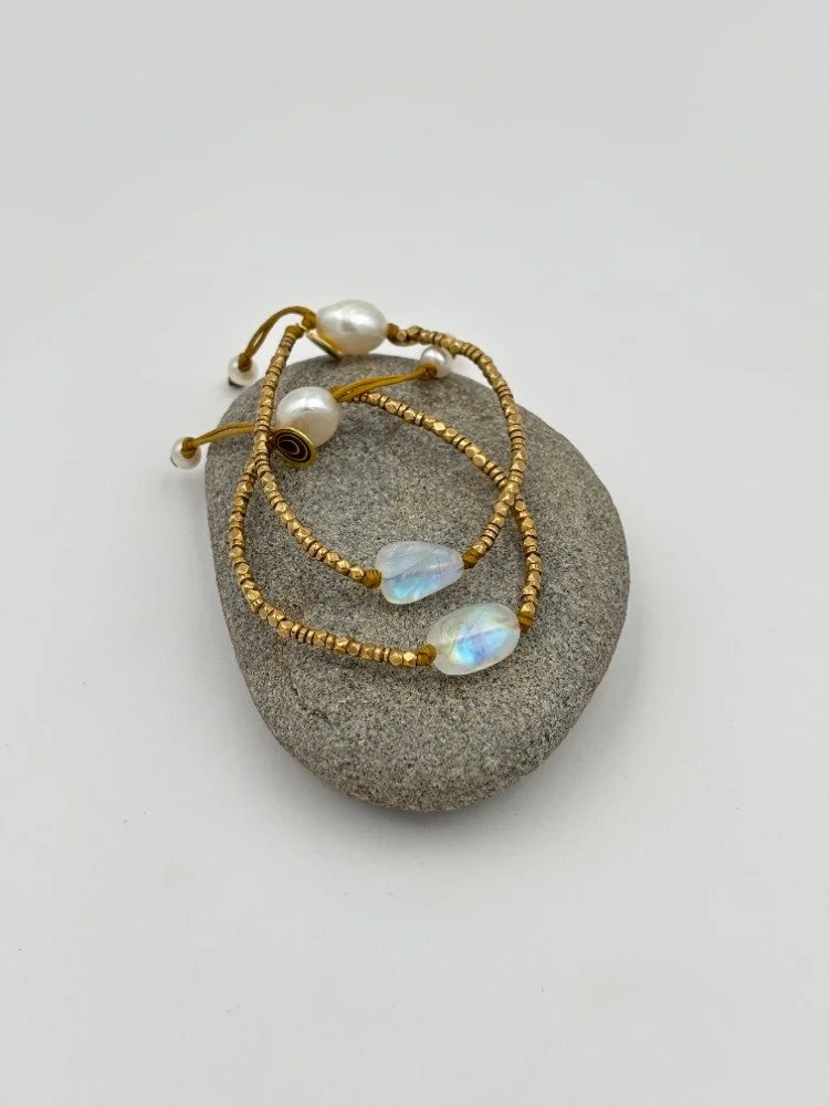double moonstone and brass on grey rock.jpg