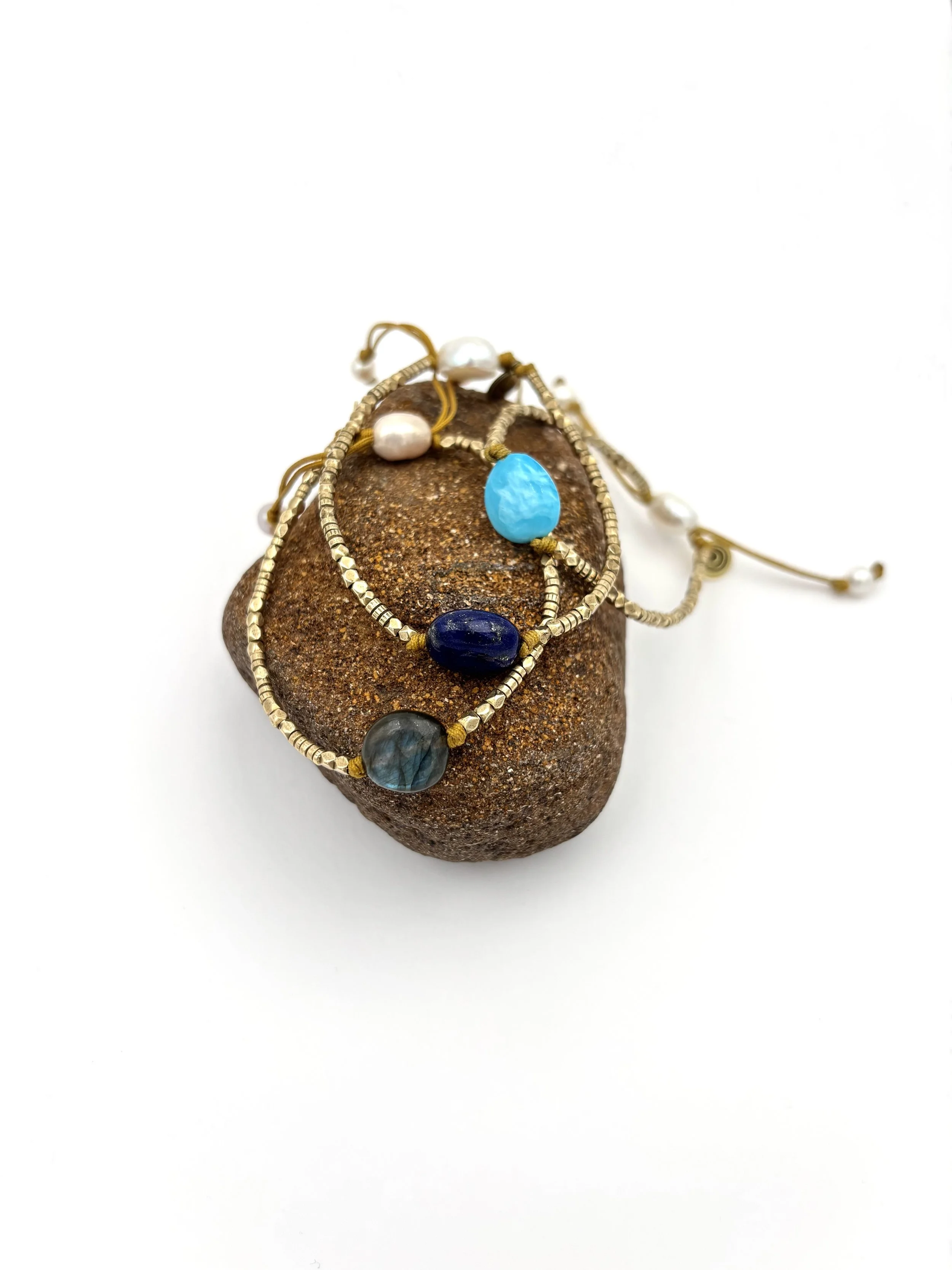 brass and gem trio on rock.jpg