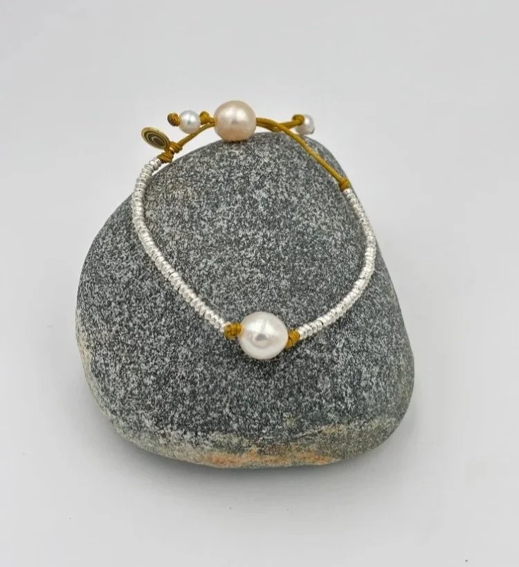 silver+and+round+white+pearl+on+rock.jpg