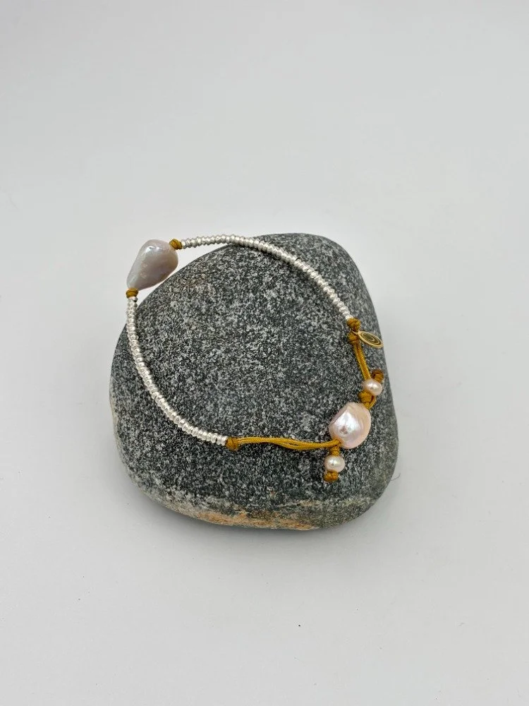 silver and white boroque pearl on rock alt.jpg