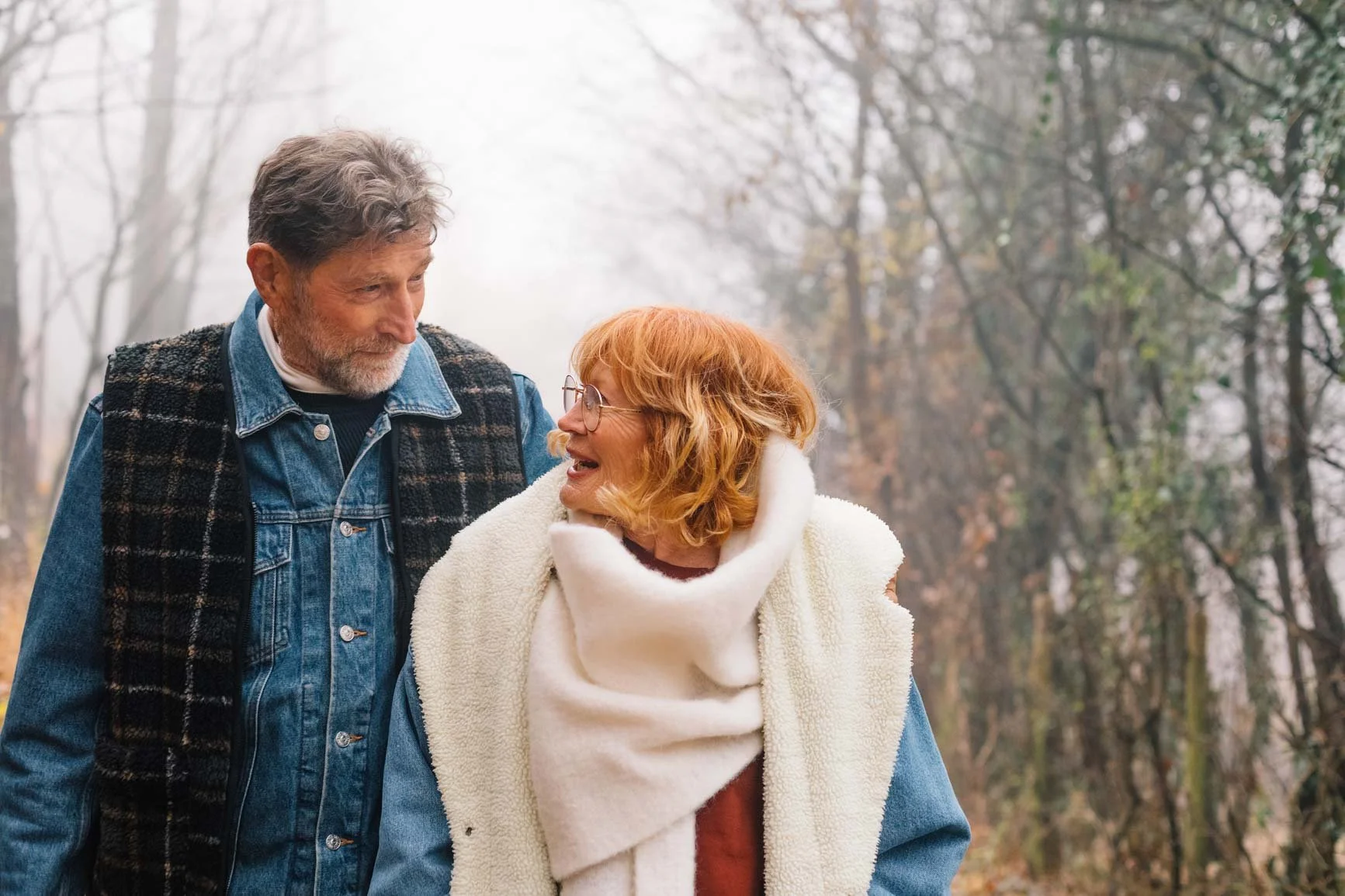 Edina_Marriage_Counseling_Edina_Minnesota_Senior_couple_walking_in_foggy_forest_Medium_5861447.jpeg