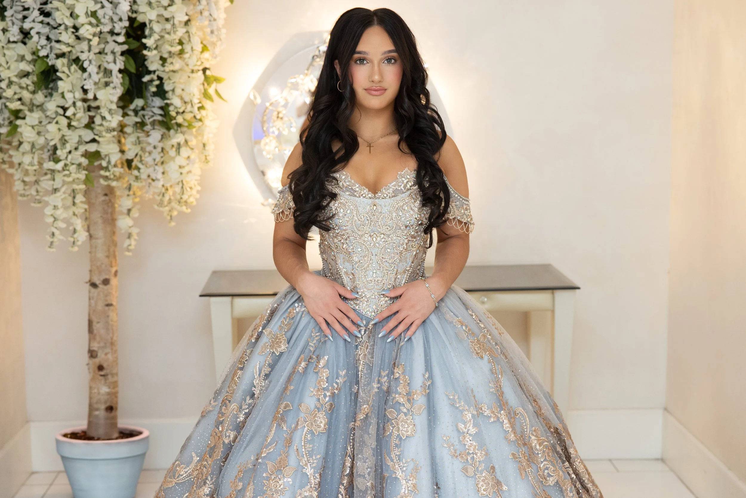 Gia Lopez wearing ornate silver and blue quinceañera gown during People Magazine exclusive coverage.
