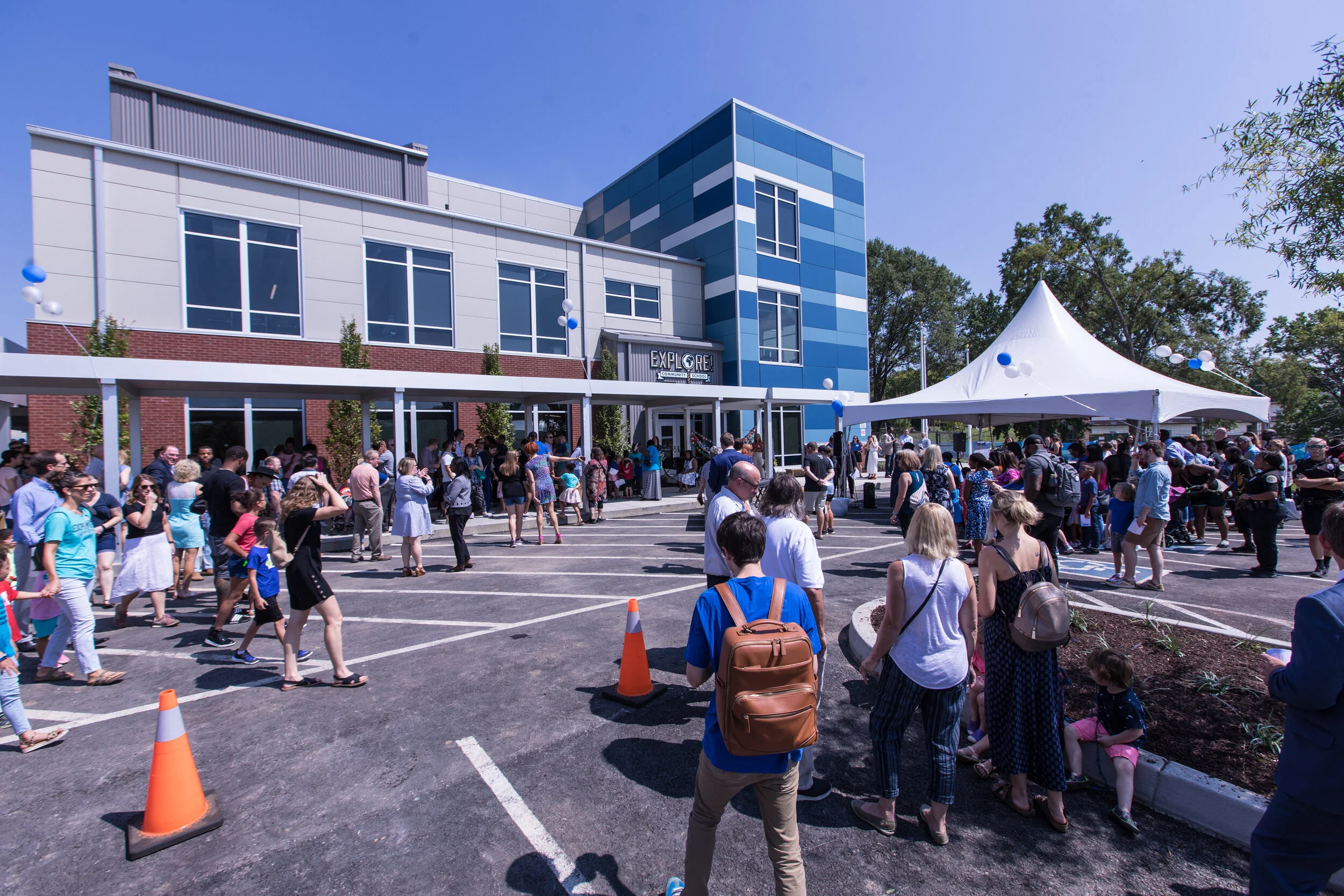 Families and community members gather in front of the new school prior to the ribbon-cutting ceremony.