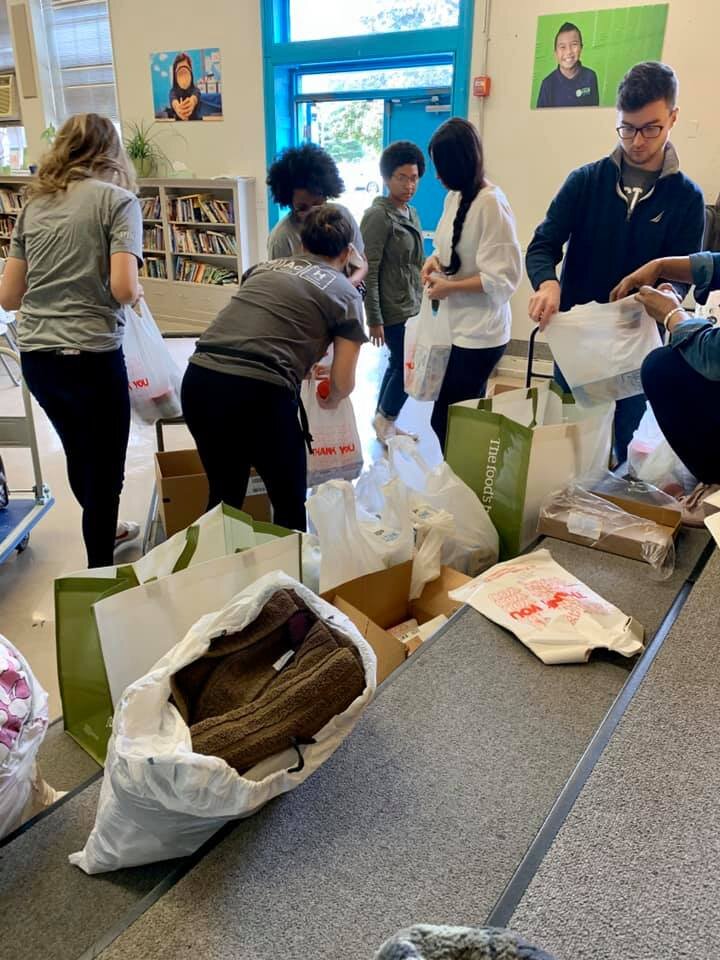 STEM Prep volunteers sort supplies for tornado victims.