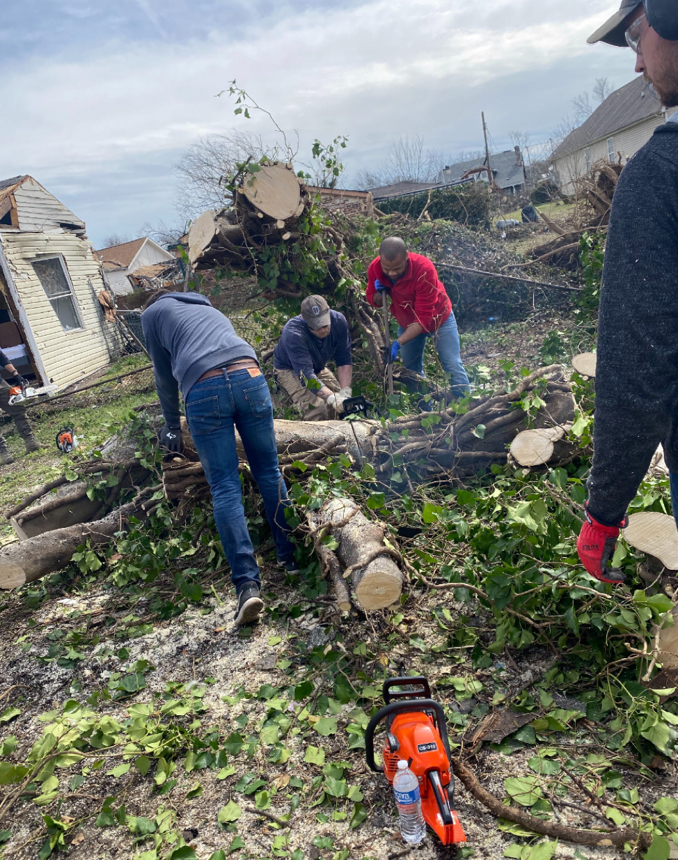 Volunteers from RePublic Schools help with tornado cleanup.