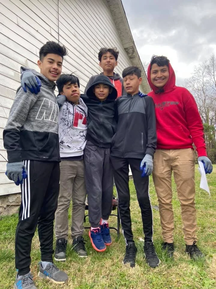 Members of the KIPP Academy Nashville soccer team help with tornado cleanup.