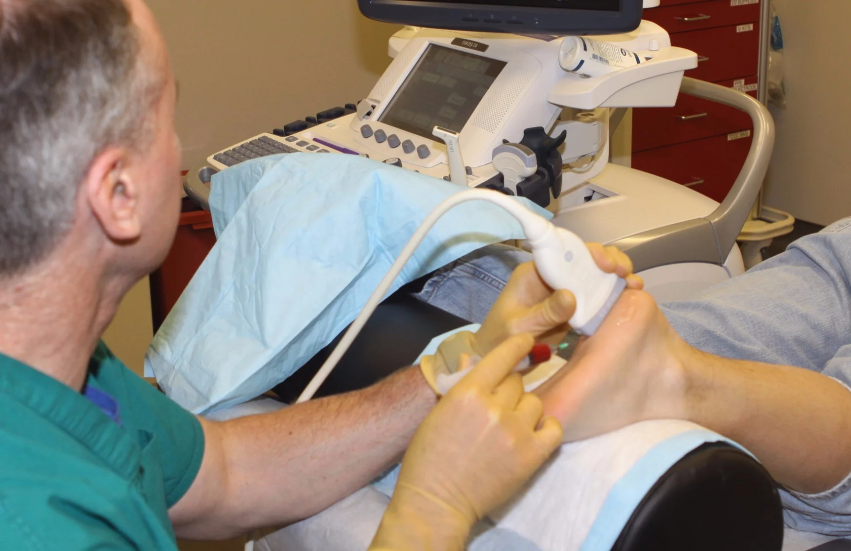 Dr. Mulvaney injecting platelet rich plasma (PRP) into a plantar fascia using real-time ultrasound-guidance. (The foot is totally numb from an ultrasound-guided regional block so this injection is painless.)