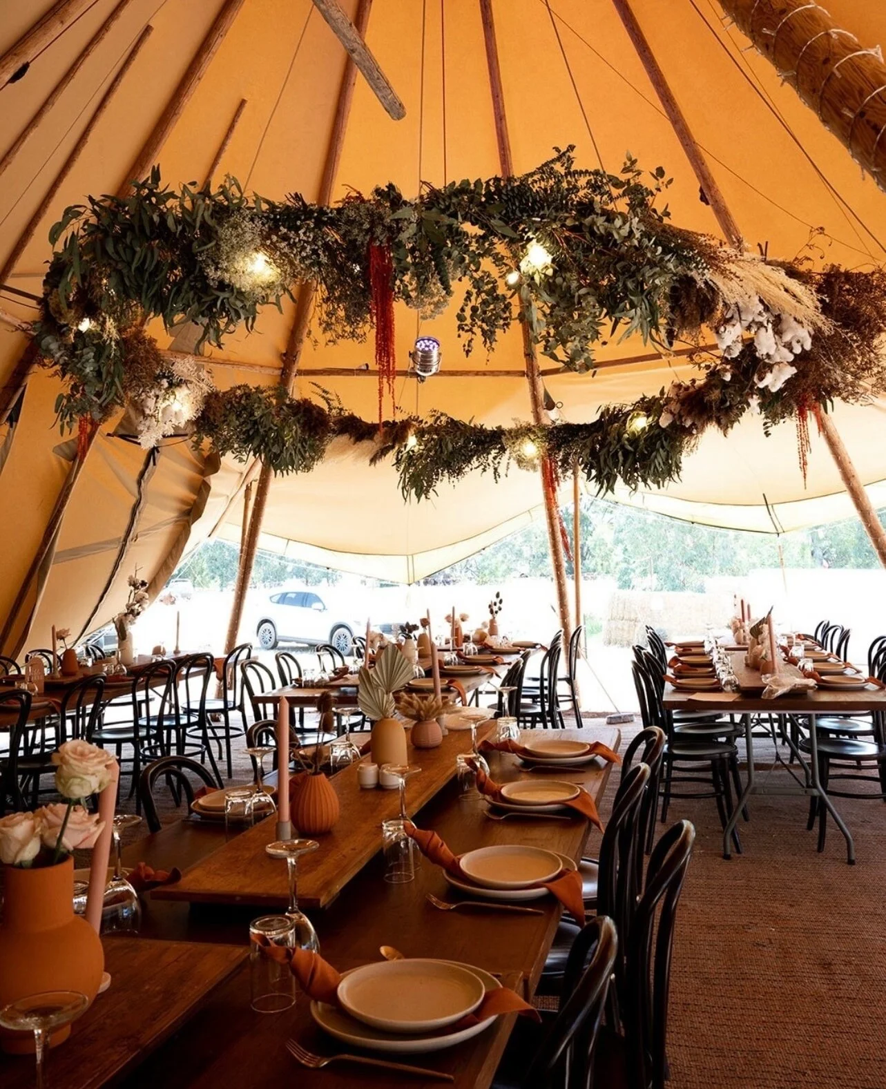 Sometimes we forget this is real life and not a fantasy scene too. Our giant tipis make the most delicious dinner setting with full tables and a ceiling ring draped in foliage and delicate twinkling lights 🌿⁠
⁠
Don't you just want to stay forever? w
