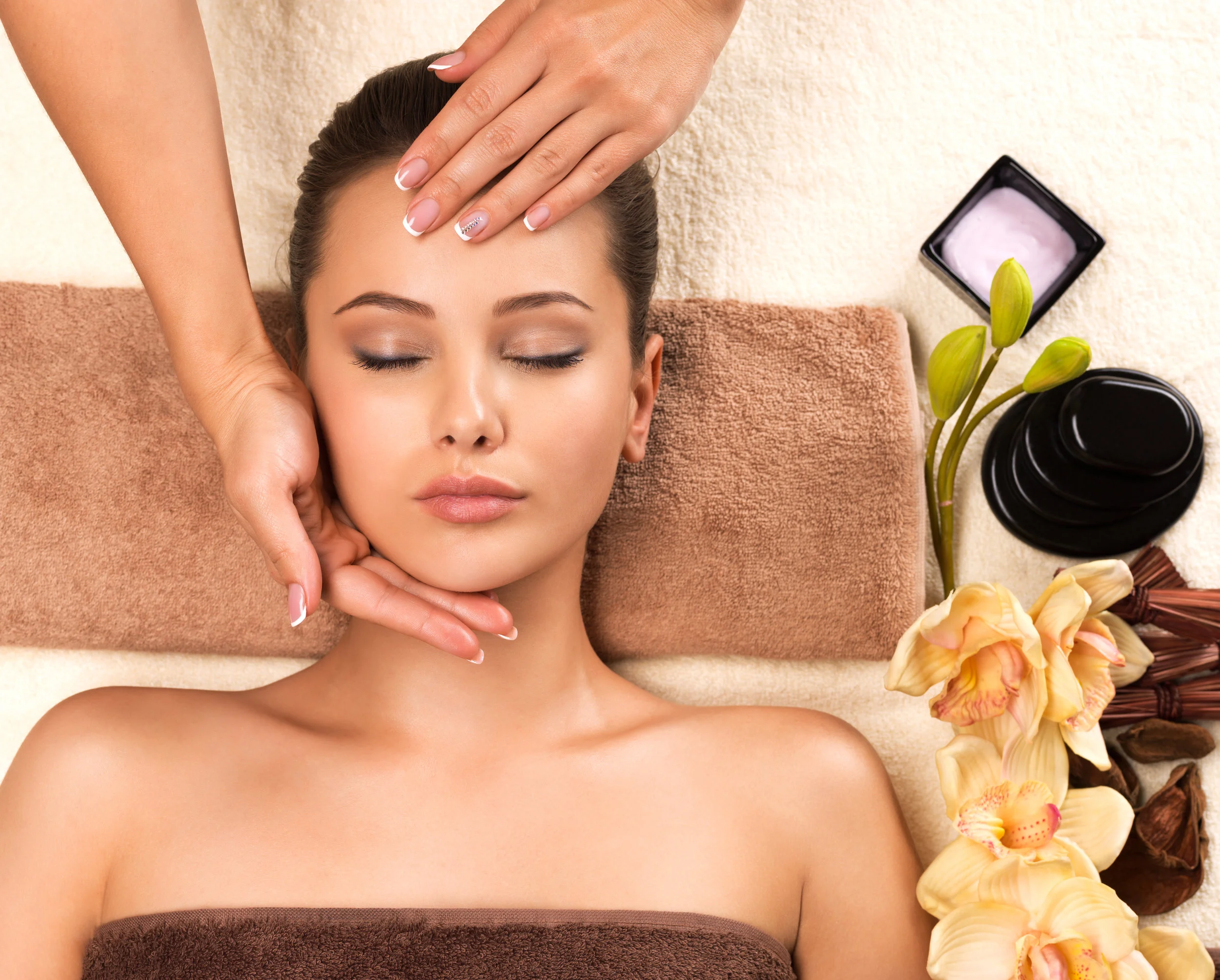 beautiful-young-woman-relaxing-with-head-massage-TBS5XJA.jpg