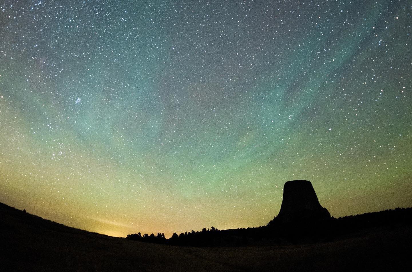 Delicate bands of green colored airglow stretch across the sky in this late summer photo of Devils Tower in Wyoming. Airglow is the name given to the faint light given off by high altitude air at night. The energy is absorbed from sunlight during the