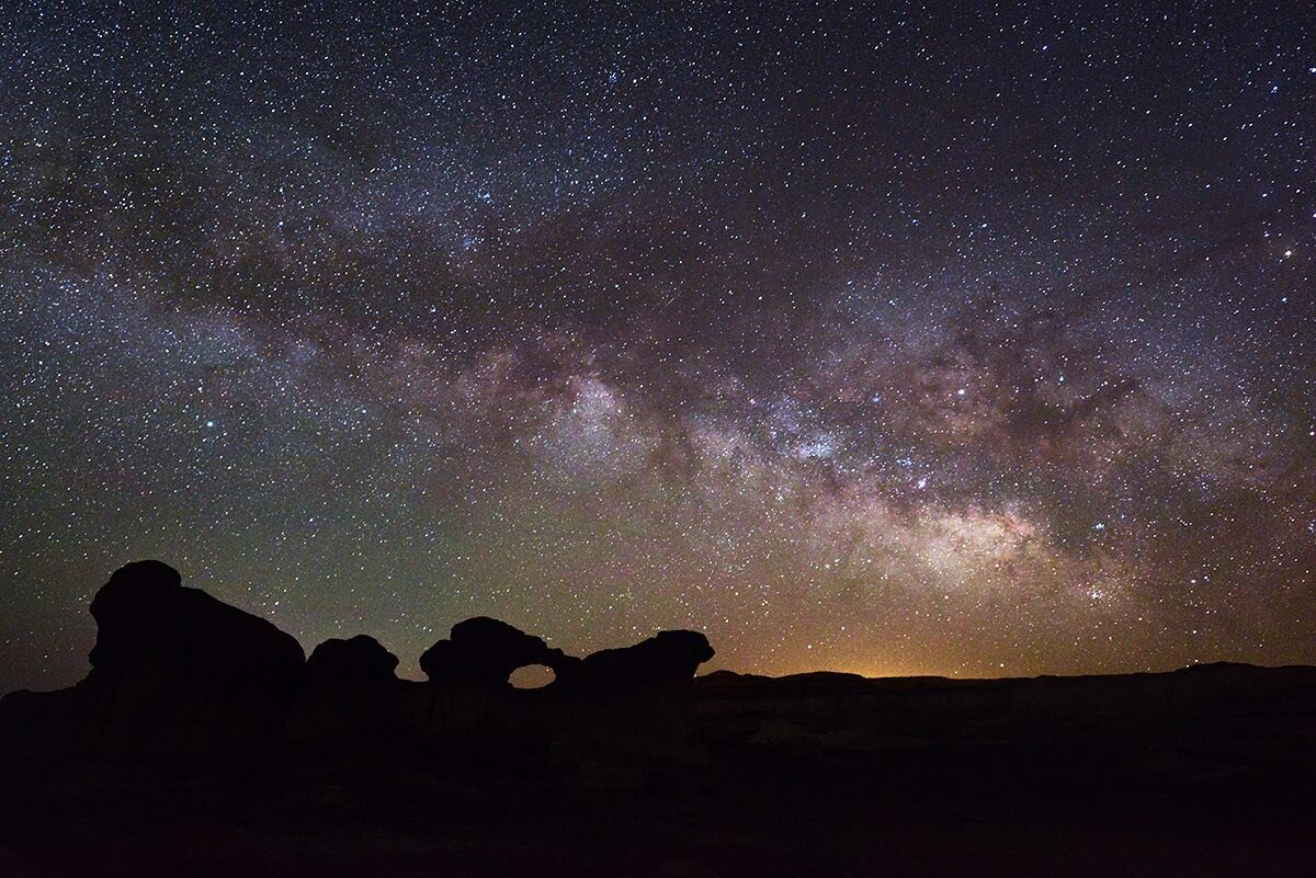 The central band of our Milky Way galaxy rises over a rock arch in the backcountry of New Mexico; now is the time of year when this type of image starts to become possible. Later in the year the Milky Way arches high in the sky when it emerges from e