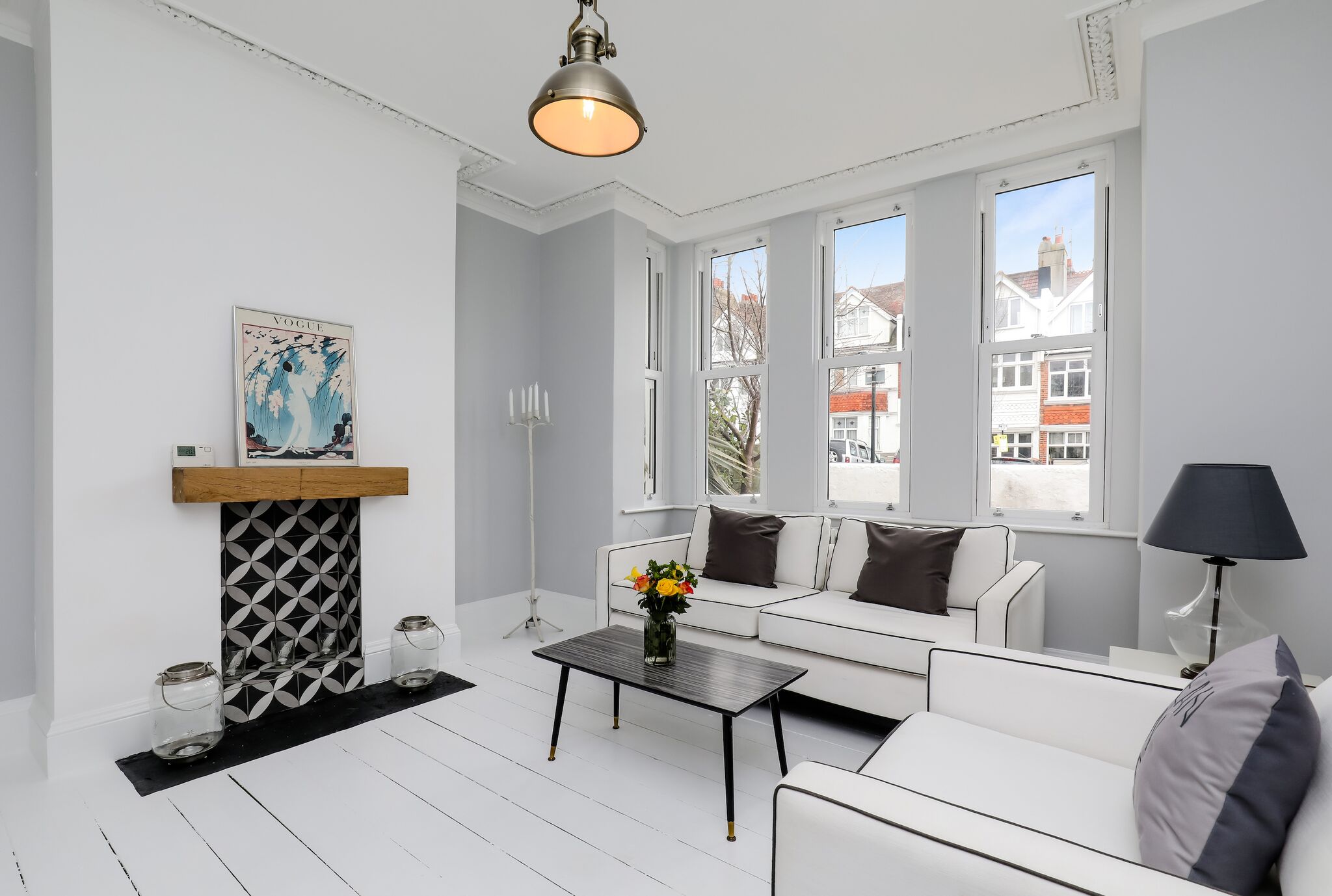 Triple aspect windows, feature fireplace, white washed original floors and industrial fisherman’s lanterns…i love the way this space has come together.