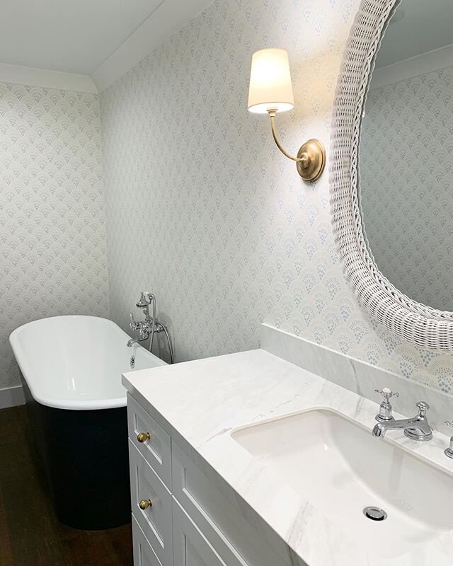 Wallpaper installations are like Christmas morning! Love how this one turned out with the navy tub 🛁. Art up next. #karahebertinteriors